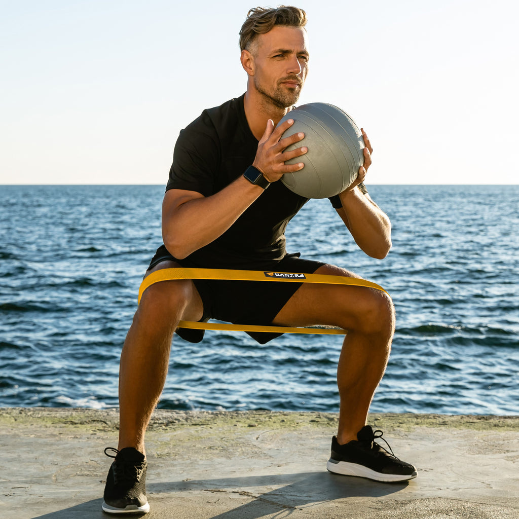 a boy using the Resistance Exercise Booty Bands outdoor